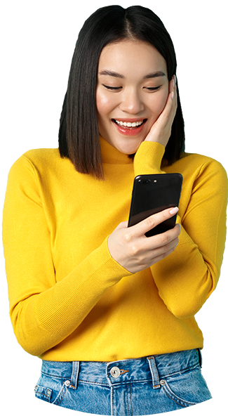 seoGEEK image of happy asian woman reading message on mobi FKGGSJ9 e1650561666821